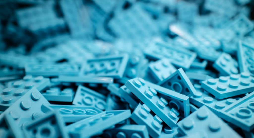 A pile of turquoise 2×4 LEGO plates.