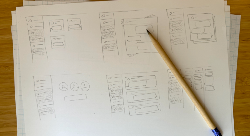 A pencil lying on top of a stack of paper. The top piece of paper shows 6 quick UI sketches.
